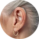 close-up-womans-ear-hearing-aid